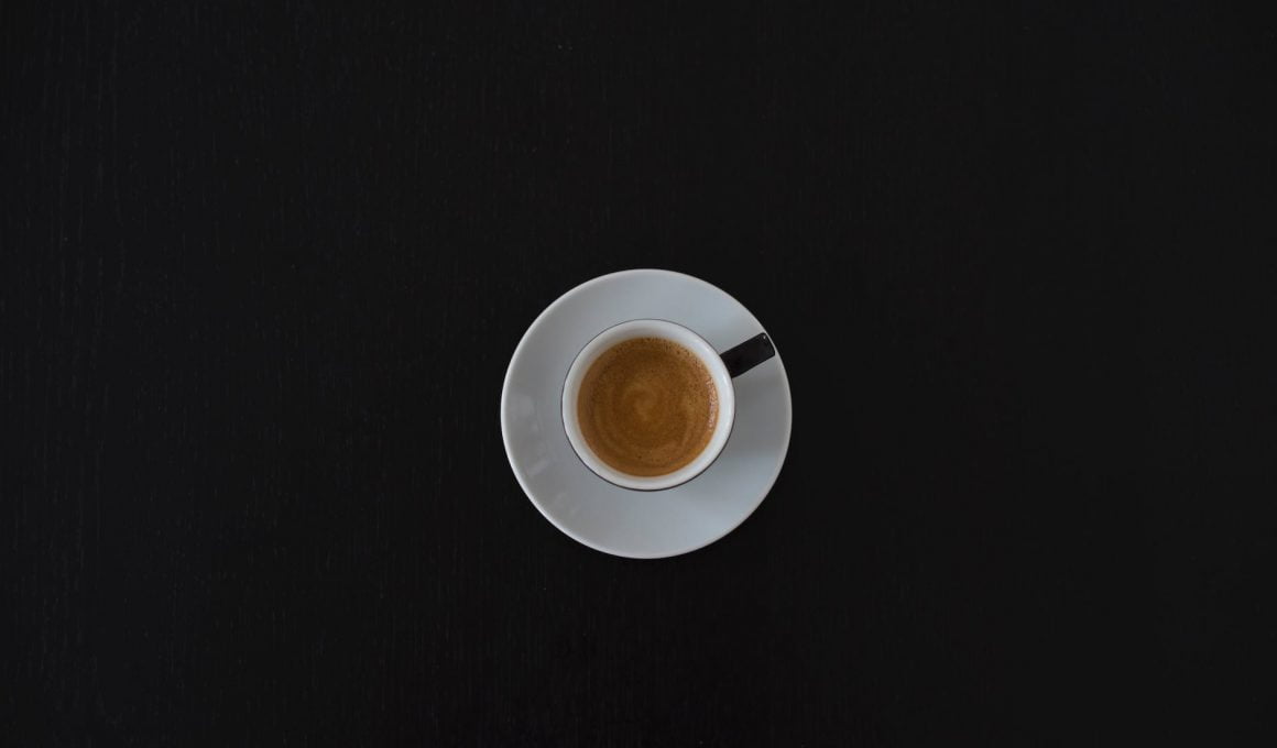white ceramic coffee cup on white saucer
