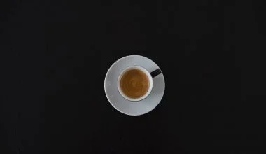 white ceramic coffee cup on white saucer