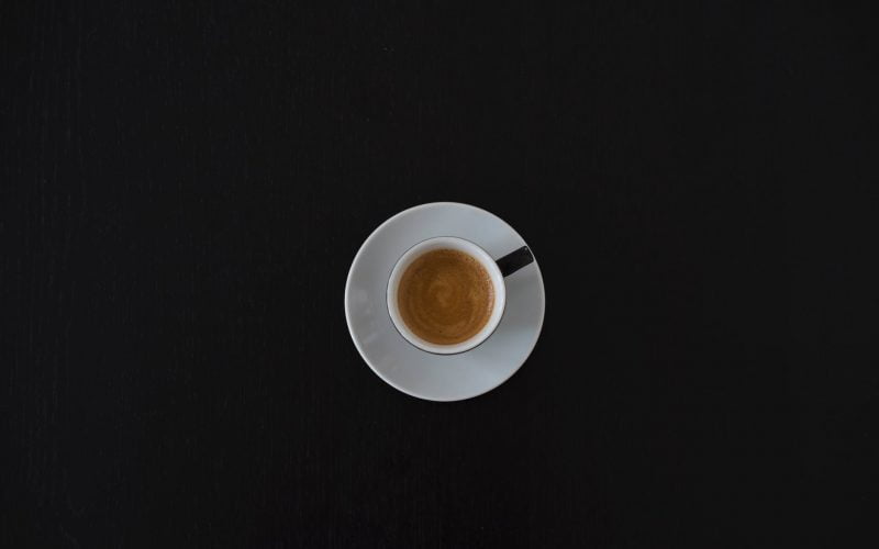 white ceramic coffee cup on white saucer